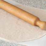 Whole grain dough rolled out 