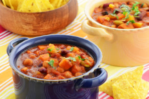 Bowls of chilli with tortilla chips