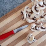 Sliced Mushrooms on Cutting Board