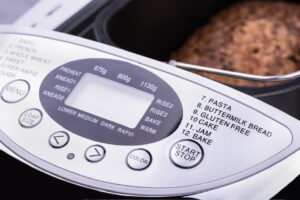 Close-up view of electric bread maker digital display (with gluten-free setting)