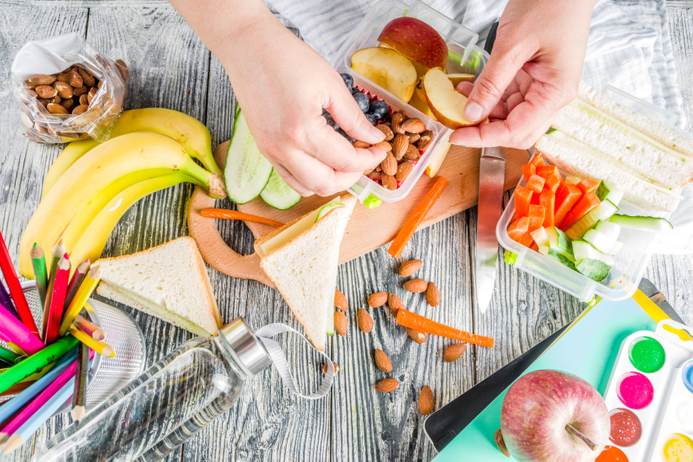 Mother making school lunch.