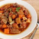 Beef stew in white bowl.