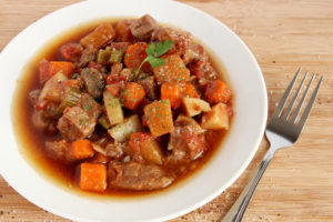 Beef stew in white bowl.