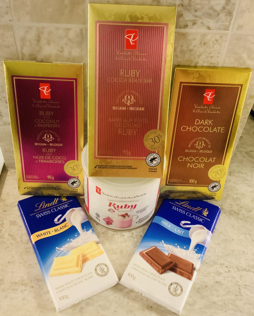 Products for taste-test: President's Choice bars - ruby (plain), ruby with coconut & raspberry and dark chocolate; President's Choice hot ruby cocoa mix; Lindt bars - white and milk.