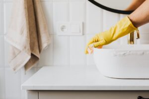 Cleaning a sink.