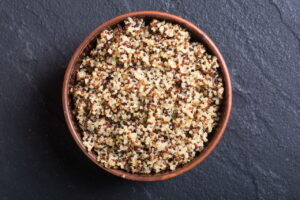 Colourful cooked quinoa in a bowl.